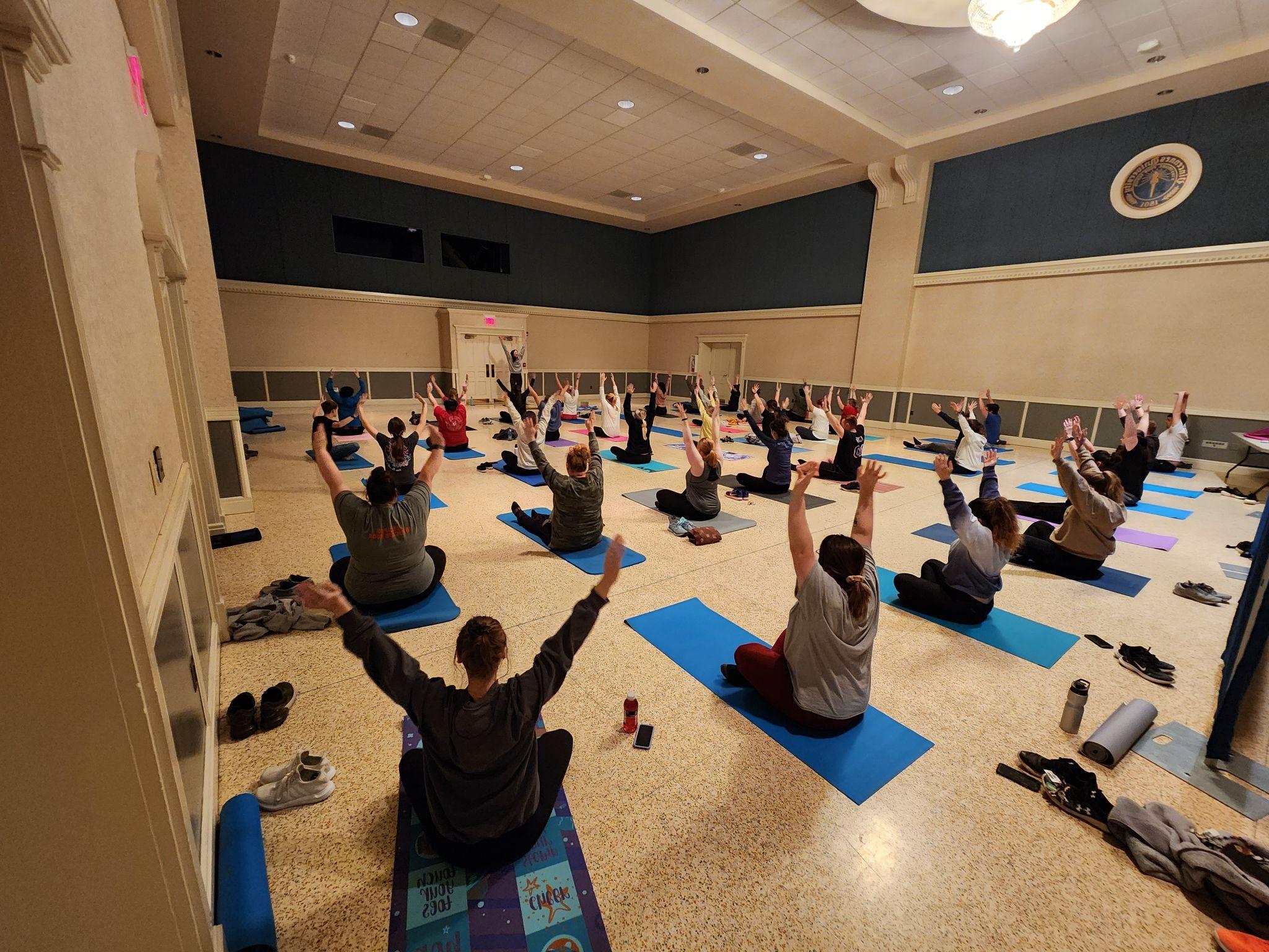 Students participating in a yoga class