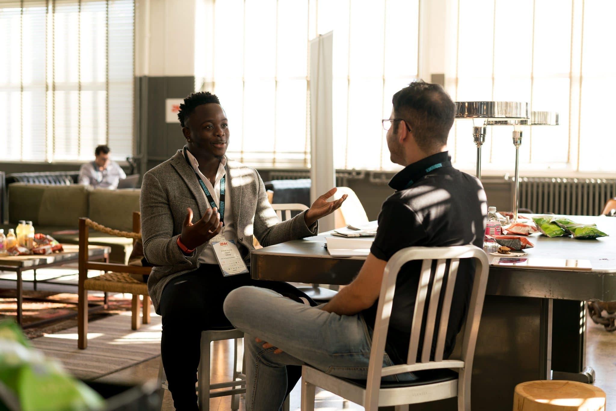 Two men sitting down in a restaurant